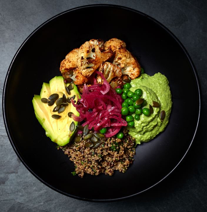 Buddha Bowl with Chipotle Cauliflower and Pea Hummus, Quinoa, Pickled Red Onions, Pumpkin Seeds