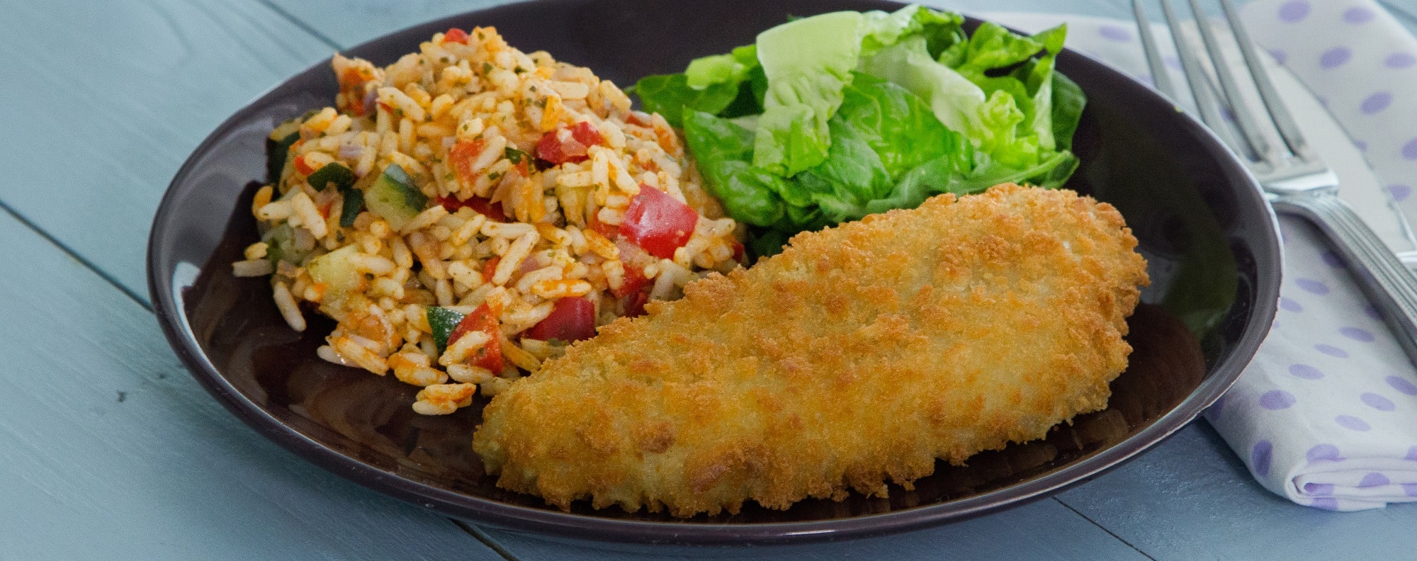 Breaded Cod Fillets with Mediterranean Rice and a side of salad